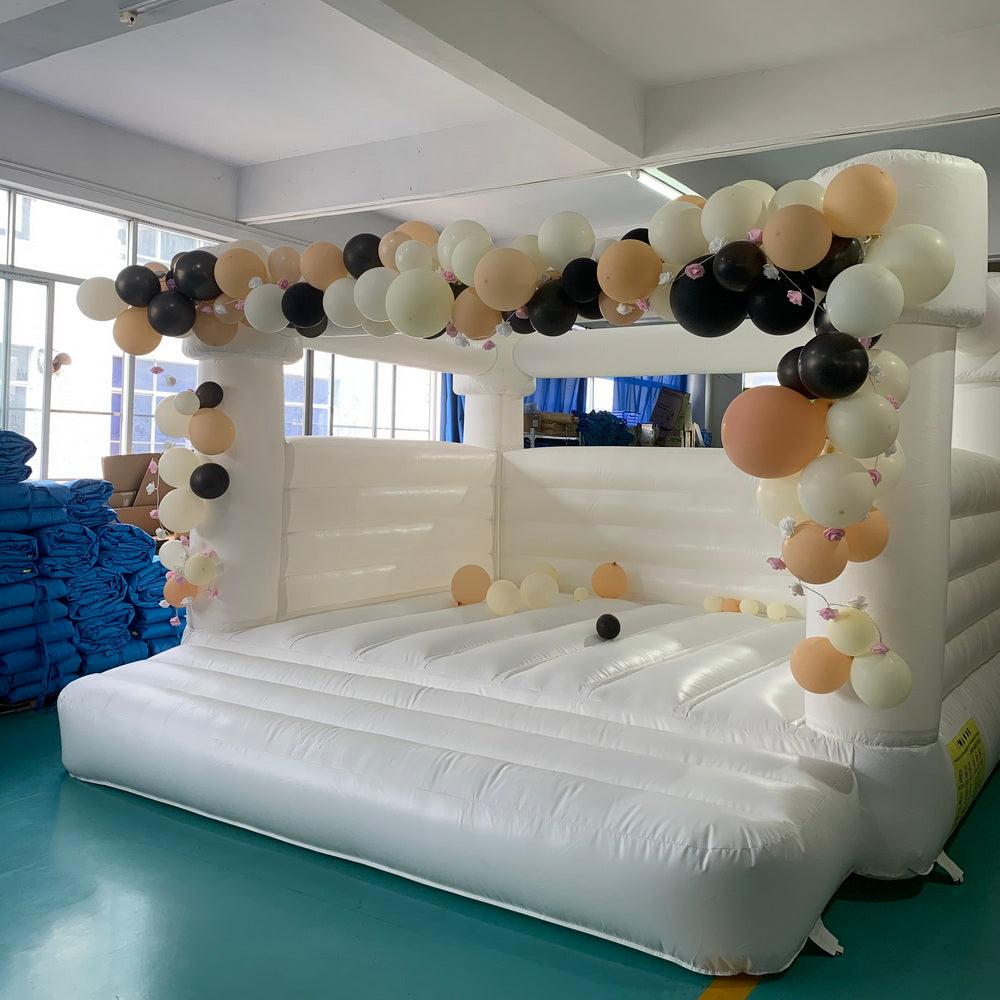 white wedding bounce house